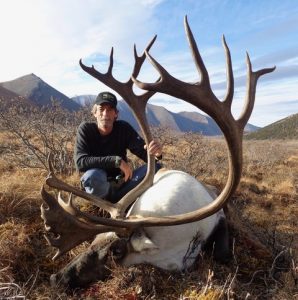 Hunter With a Caribou