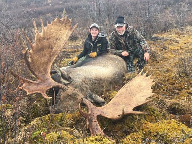 Two Hunters with a Moose